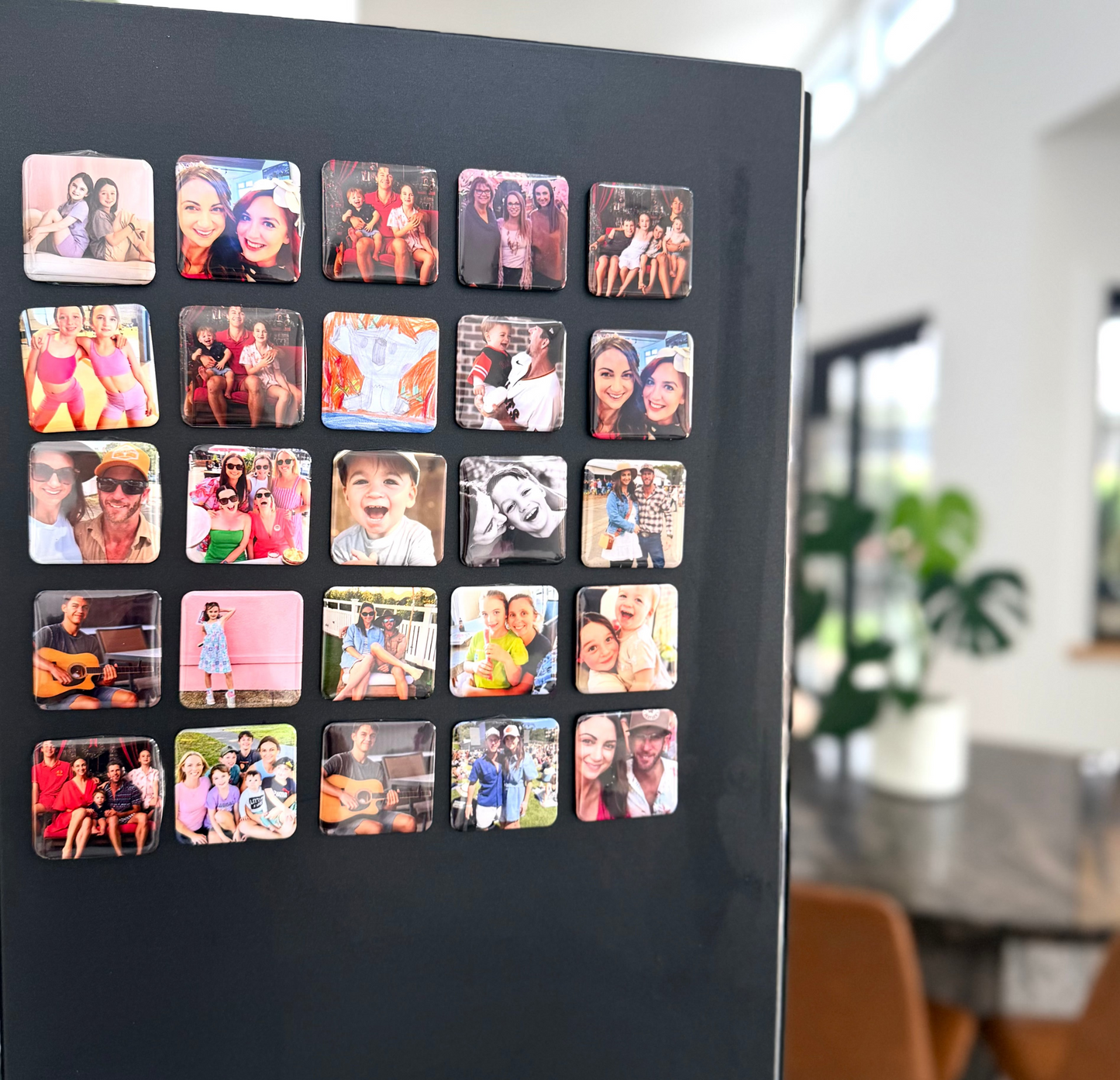 square magnets displaying various photos in a kitchen setting